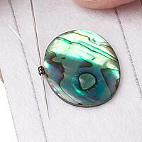 Needle beading around a cabochon